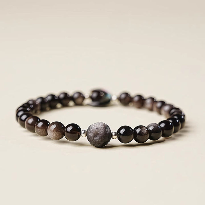 Pulsera de cuentas de obsidiana con diseño de luna y Buddha Stones, protección y brillo plateado natural - image 1