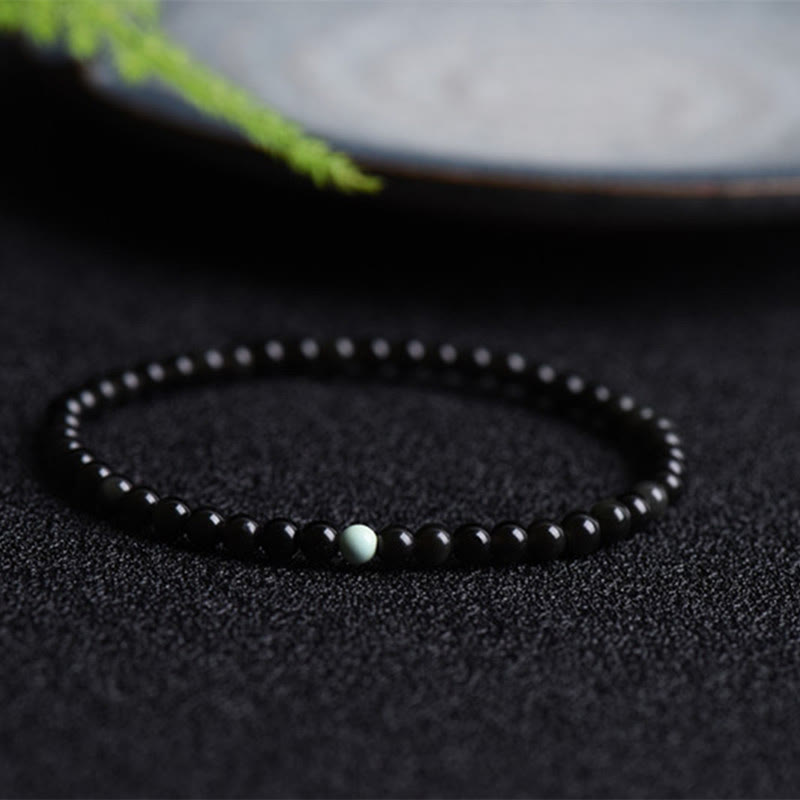 Pulsera de Obsidiana Negra y Turquesa con Buddha Stones para la Fuerza - Obsidiana negra turquesa (circunferencia de la muñeca: 14-15 cm) - image 0