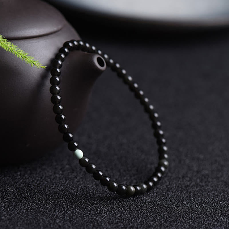 Pulsera de Obsidiana Negra y Turquesa con Buddha Stones para la Fuerza - image 2