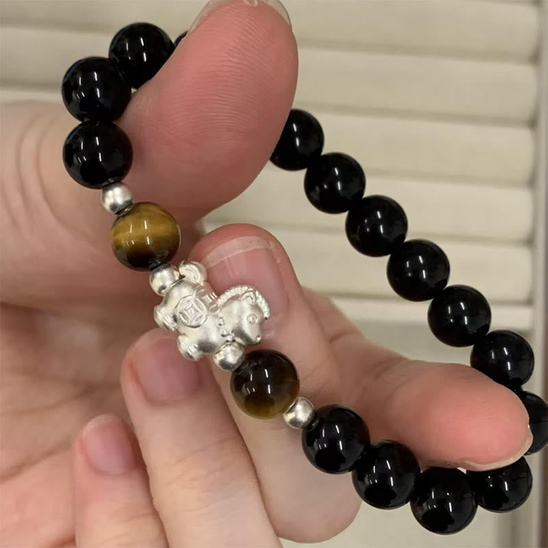 Pulsera de fuerza con dije de caballo de obsidiana negra y ojo de tigre en plata de ley 999 con Buddha Stones y año del caballo - image 1
