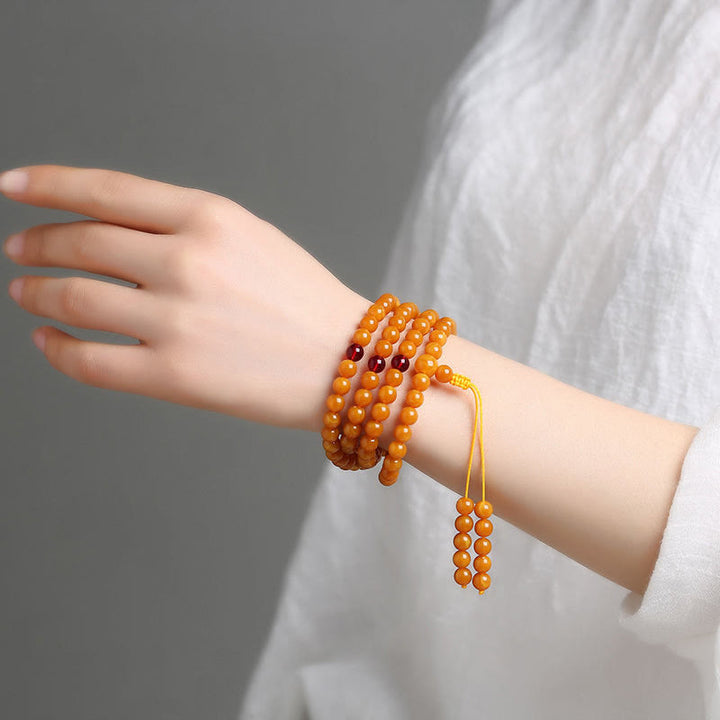 Mala de cuentas redondas de ámbar tibetano con Buddha Stones - image 10