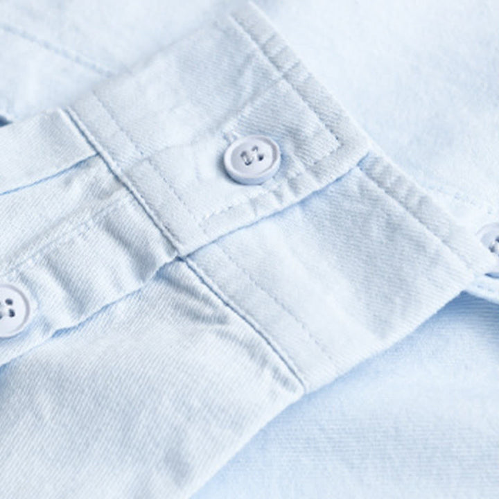 Camisa de algodón de manga larga para hombre con cuello alto y bolsillos decorativos, con botones sólidos y estampado de Buddha Stones Spring - image 3