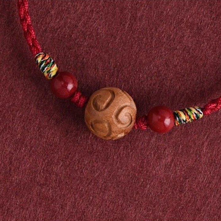 Pulsera de cuerda de madera de melocotón natural con Buddha Stones talladas y patrón auspicioso - image 10