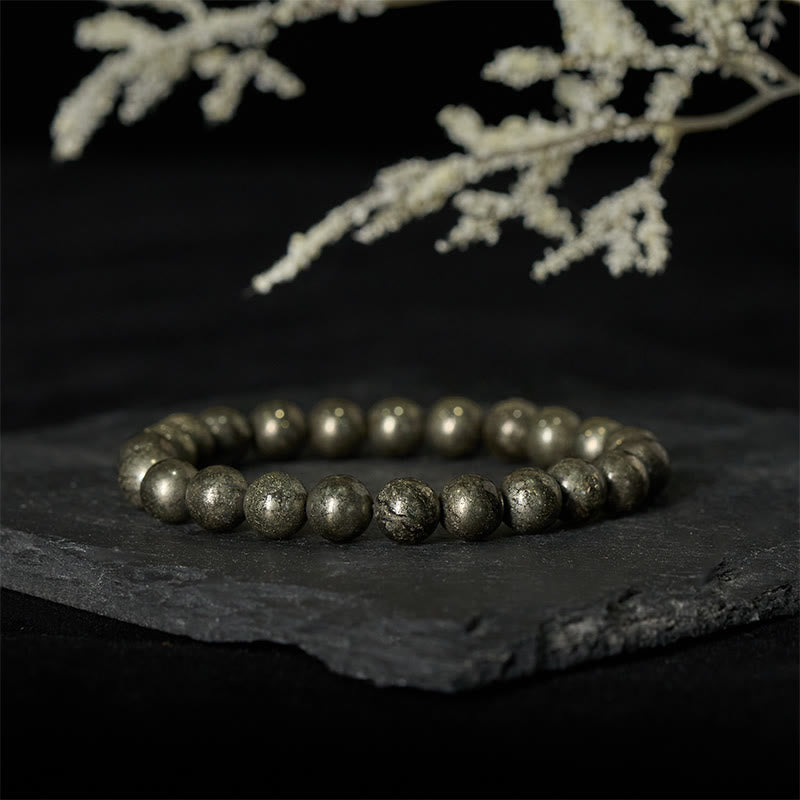 Pulsera de cuentas redondas de pirita y Buddha Stones que promueve la confianza y la abundancia - image 1