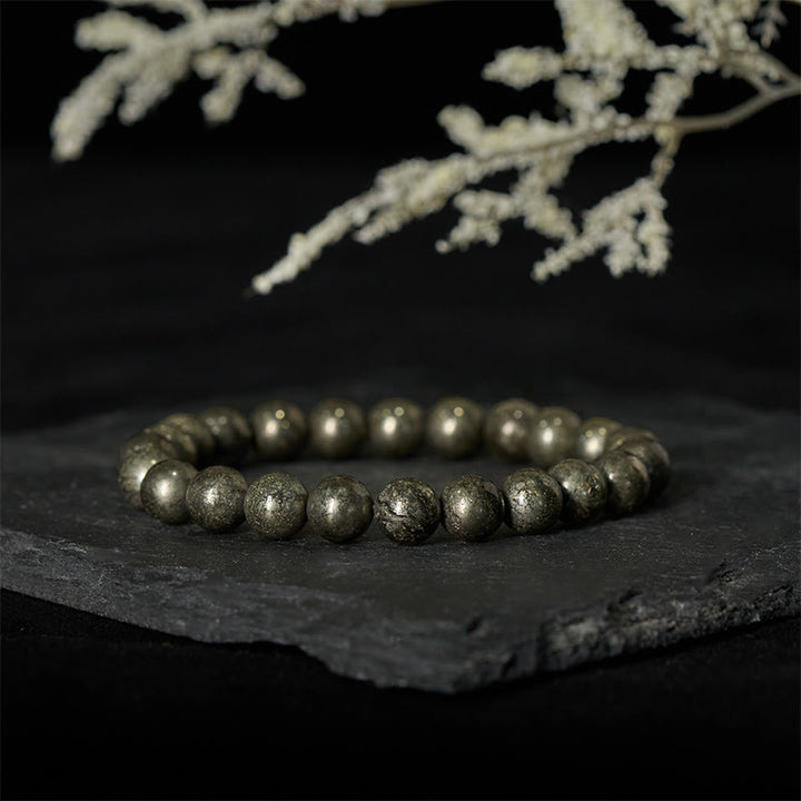 Pulsera de cuentas redondas de pirita y Buddha Stones que promueve la confianza y la abundancia - image 1
