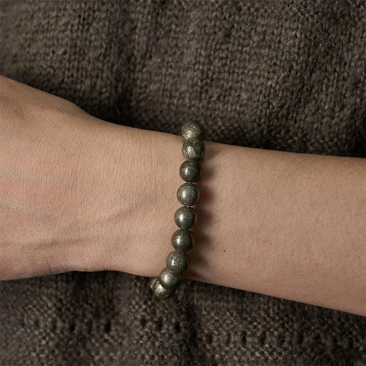 Pulsera de cuentas redondas de pirita y Buddha Stones que promueve la confianza y la abundancia - image 4