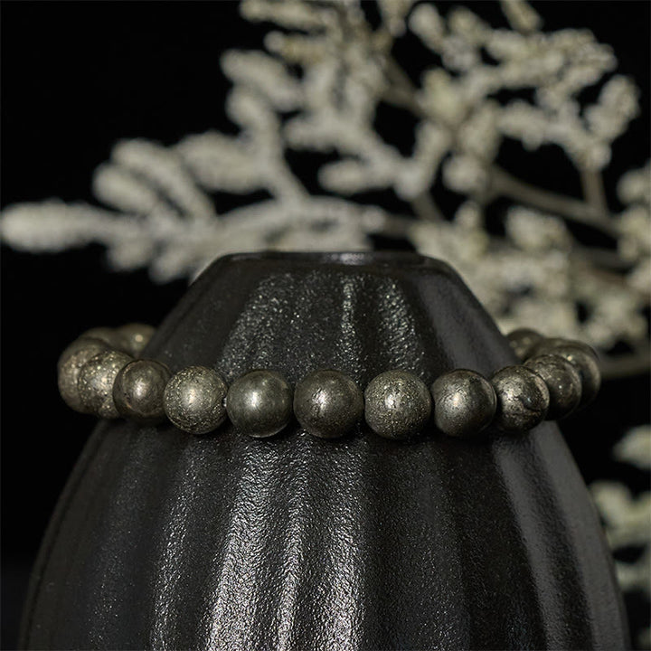 Pulsera de cuentas redondas de pirita y Buddha Stones que promueve la confianza y la abundancia - image 2
