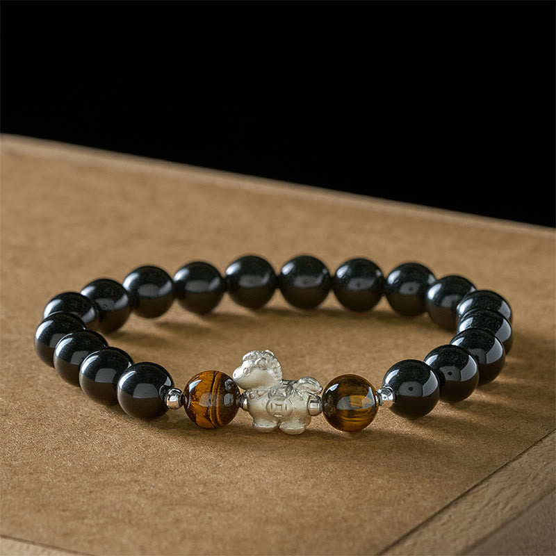 Pulsera de fuerza con dije de caballo de obsidiana negra y ojo de tigre en plata de ley 999 con Buddha Stones y año del caballo - image 1