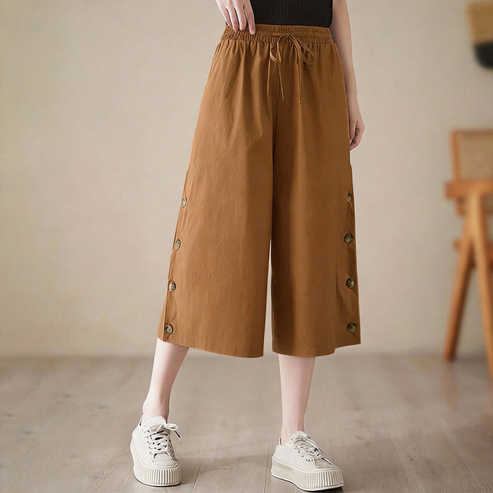 Buddha Stones Pantalones capri de pierna ancha para mujer con diseño abotonado lateral liso y bolsillos - image 2