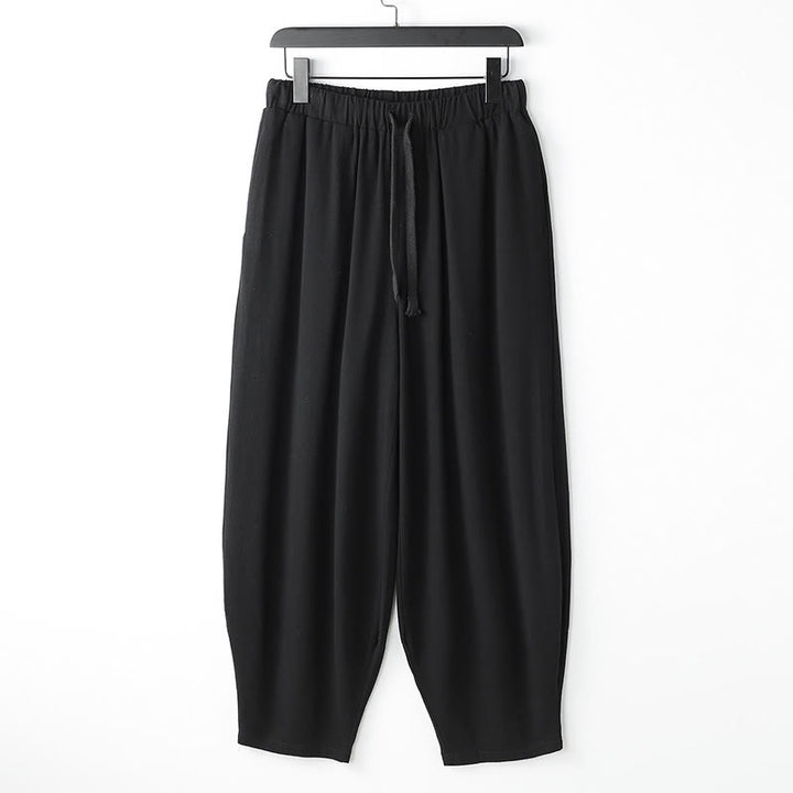Buddha Stones Pantalones harén de verano para hombre, de color liso, con cordón ajustable y bolsillos hasta el tobillo - Negro - US/UK/AU54, EU64 (9XL) - image 1