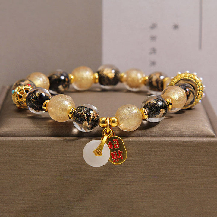 Buddha Stones Pulsera de bendición con hebilla de paz y cuentas de vidrio Liuli de oro negro que atrae la riqueza - 14-16 cm - image 0