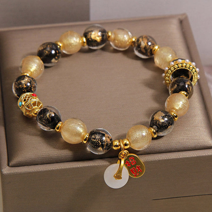 Buddha Stones Pulsera de bendición con hebilla de paz y cuentas de vidrio Liuli de oro negro que atrae la riqueza - image 1