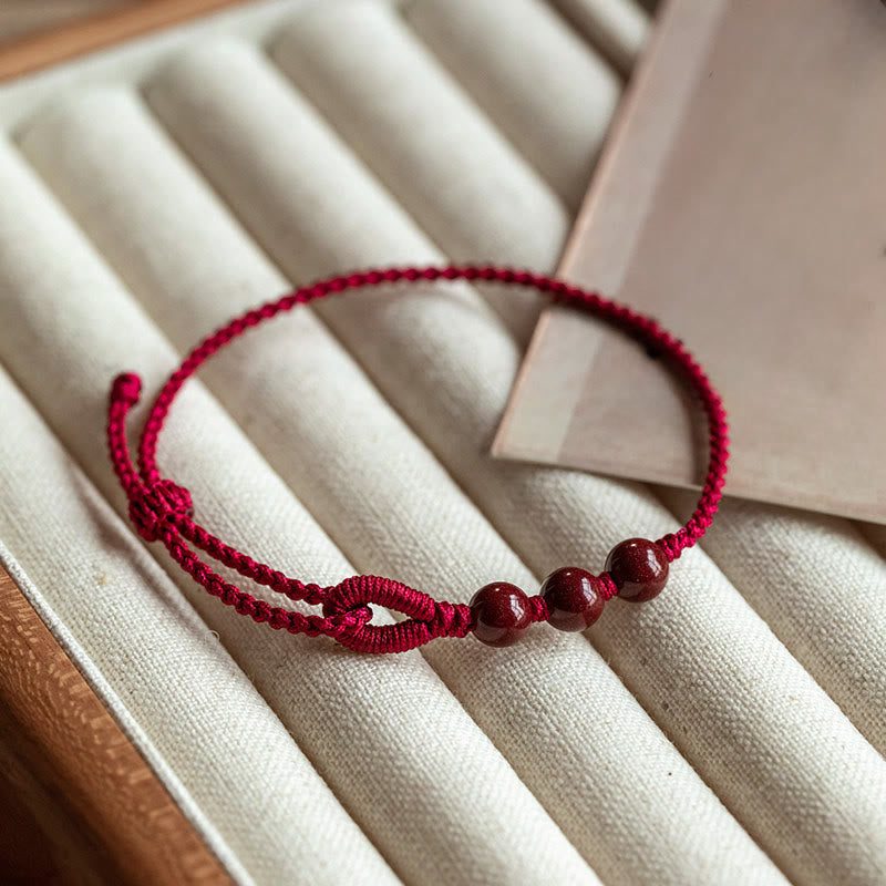 Buddha Stones Pulsera trenzada de cuentas de cinabrio con bendición de la calma hecha a mano - Cuerda roja oscura (circunferencia de la muñeca 16-18 cm) - image 0