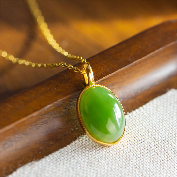 Buddha Stones Colgante de plata de ley 925 con diseño redondo de jade Hetian natural, símbolo de prosperidad. - Jade (Ligera variación de color debido a que es un jade natural). - image 0