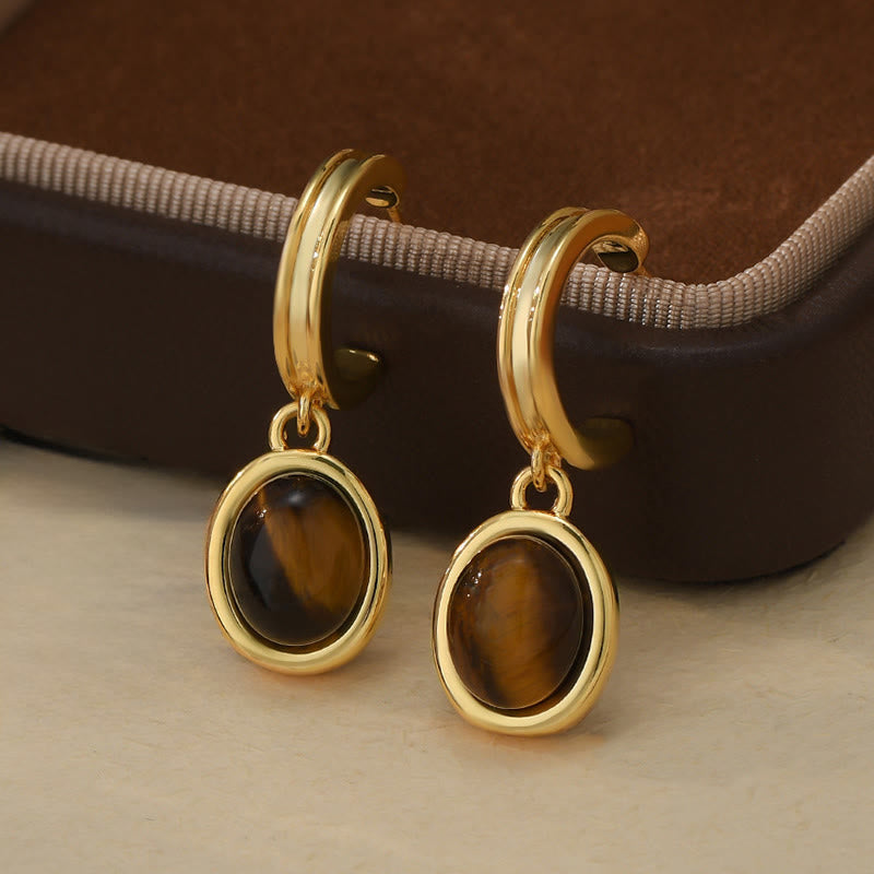 Buddha Stones Pendientes de protección redondos de cobre estilo retro con ojo de tigre - Ojo de tigre (postes de plata de ley 925) - image 0