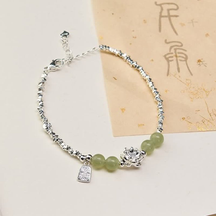 Buddha Stones Pulsera de abundancia con dije de loto, jade y alegría, con cuentas de cobre. - Loto (circunferencia de la muñeca: 15-18 cm) - image 0