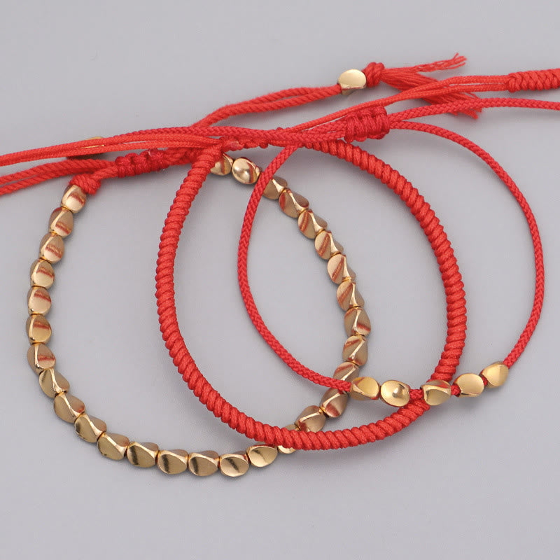 Buddha Stones Pulsera de la suerte con 3 cuentas de cobre dorado y cordón rojo - image 1