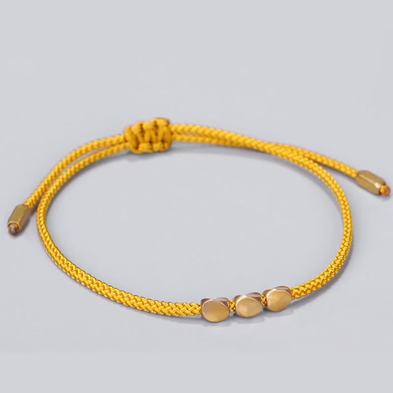 Buddha Stones Pulsera curativa de 3 piezas con cuentas de cobre dorado y hilo azul y amarillo. - image 2