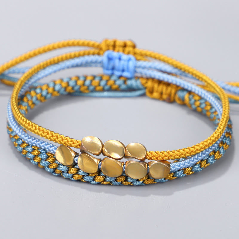Buddha Stones Pulsera curativa de 3 piezas con cuentas de cobre dorado y hilo azul y amarillo. - Cuerda (circunferencia de la muñeca: 16-26 cm) - image 0