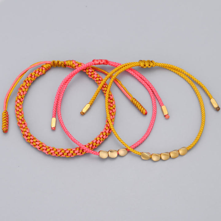 Buddha Stones Pulsera de la riqueza de 3 piezas con cuentas de cobre dorado y rosa y hilo amarillo. - image 8