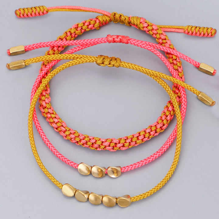 Buddha Stones Pulsera de la riqueza de 3 piezas con cuentas de cobre dorado y rosa y hilo amarillo. - image 2