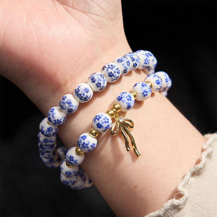 Buddha Stones Pulsera de cuentas de porcelana azul, blanca y rosa con lazo y palabra de honor - image 3