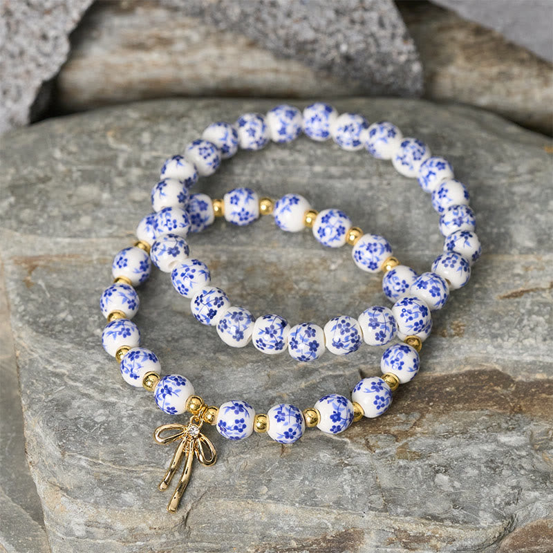 Buddha Stones Pulsera de cuentas de porcelana azul, blanca y rosa con lazo y palabra de honor - image 2