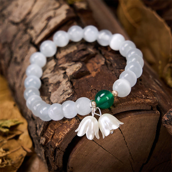 Buddha Stones Pulsera con cuentas redondas blancas de ojo de gato de 8 mm y flores de lirio del valle. - image 4