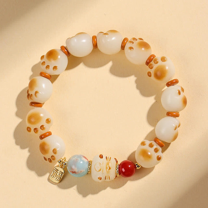 Buddha Stones Pulsera de la suerte con diseño de pata de gato y semillas de Bodhi naturales - Huella de gato (circunferencia de la muñeca: 17–18 cm) - image 0