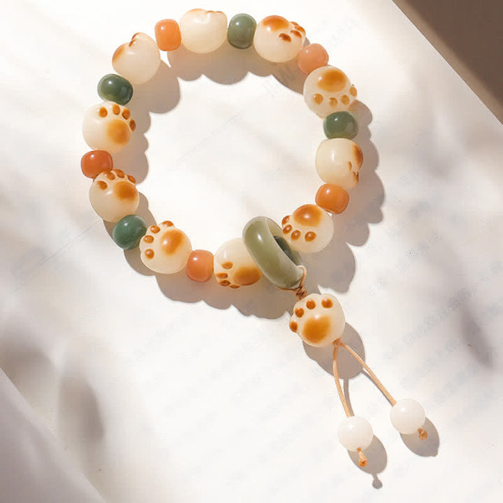 Buddha Stones Pulsera de la riqueza con diseño de huella de gato y semillas de Bodhi naturales - Colgante con forma de pata de gato (circunferencia de la muñeca: 17-18 cm) - image 0