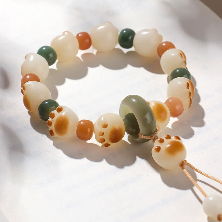 Buddha Stones Pulsera de la riqueza con diseño de huella de gato y semillas de Bodhi naturales - image 1