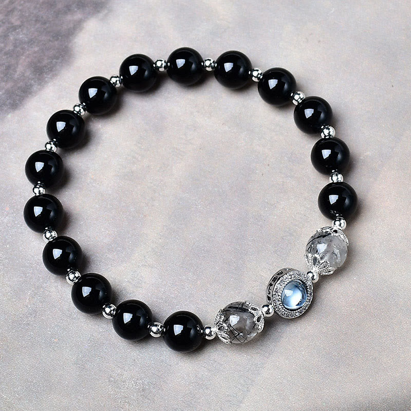 Buddha Stones Pulsera purificadora de obsidiana negra con brillo plateado y circonitas. - image 1