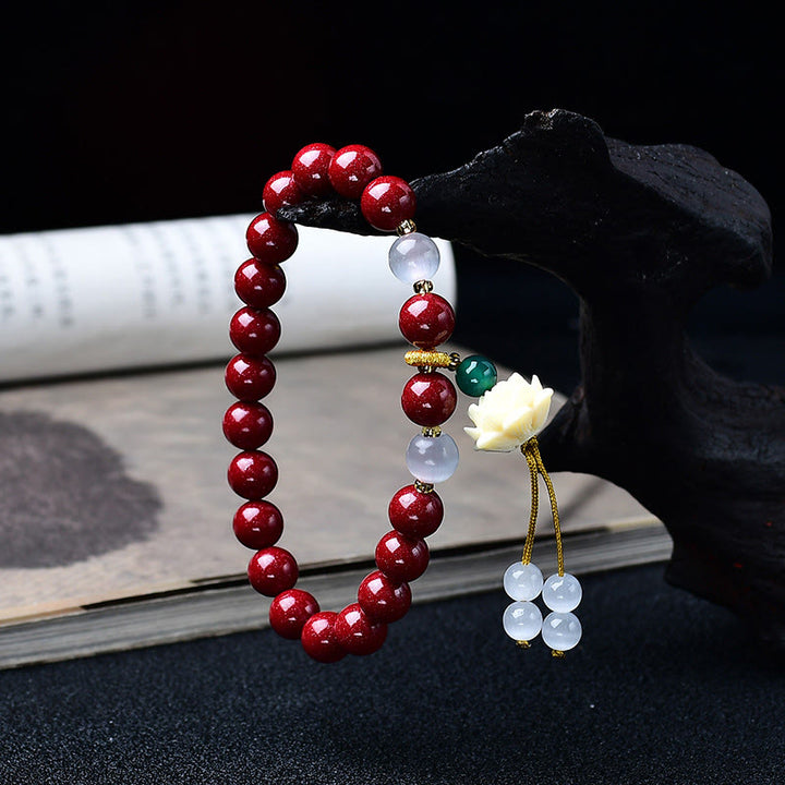 Buddha Stones Pulsera con dije de loto de marfil ojo de gato de cinabrio natural y bendición - image 1
