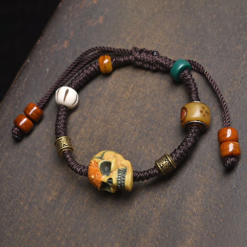 Buddha Stones Pulsera de cuerda trenzada con diseño de Bone, el Señor del Bosque de los Cadáveres, para alejar a los espíritus malignos. - Cuerda marrón (circunferencia de la muñeca: 17-23 cm) - image 0