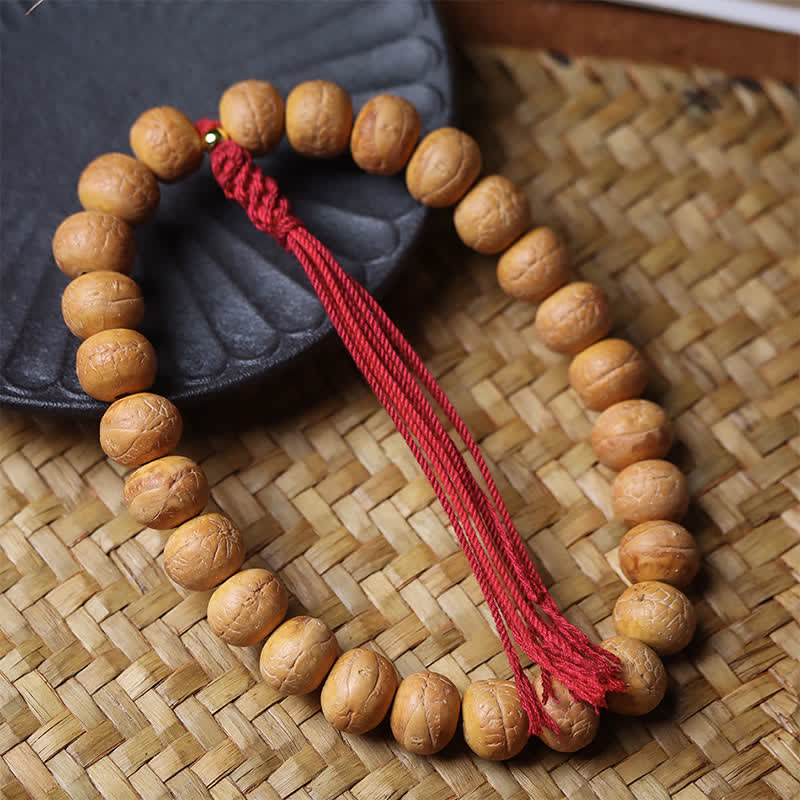 Buddha Stones Mala de muñeca tibetana con borla grabada y ojo de fénix y sabiduría Bodhi - image 1