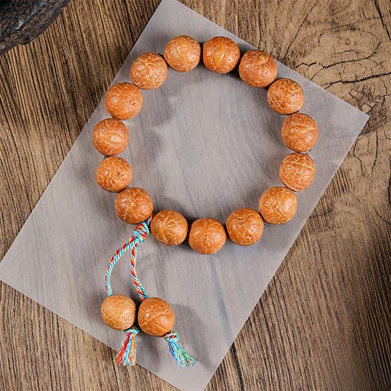 Buddha Stones Mala étnica tallada a mano con el símbolo del ojo de fénix y la sabiduría de Bodhi - dije de pulsera mala con forma de ojo de fénix - 15 mm - Bodhi Ojo de Fénix (Protección♥Sabiduría) - image 0