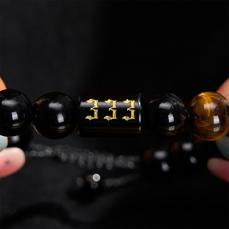 Buddha Stones Pulsera de fuerza y ​​plenitud con obsidiana negra natural y ojo de tigre, con número angelical - image 1