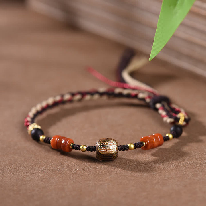 Buddha Stones Pulsera trenzada con borla de sándalo rojo tejida a mano con símbolo de bendición - image 2