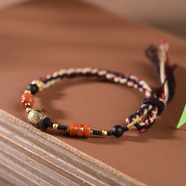 Buddha Stones Pulsera trenzada con borla de sándalo rojo tejida a mano con símbolo de bendición - image 3