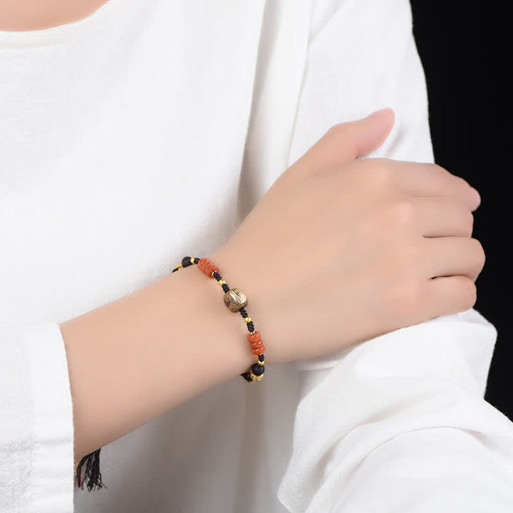 Buddha Stones Pulsera trenzada con borla de sándalo rojo tejida a mano con símbolo de bendición - image 11