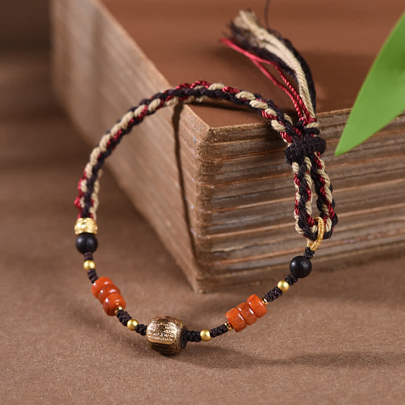 Buddha Stones Pulsera trenzada con borla de sándalo rojo tejida a mano con símbolo de bendición - image 1