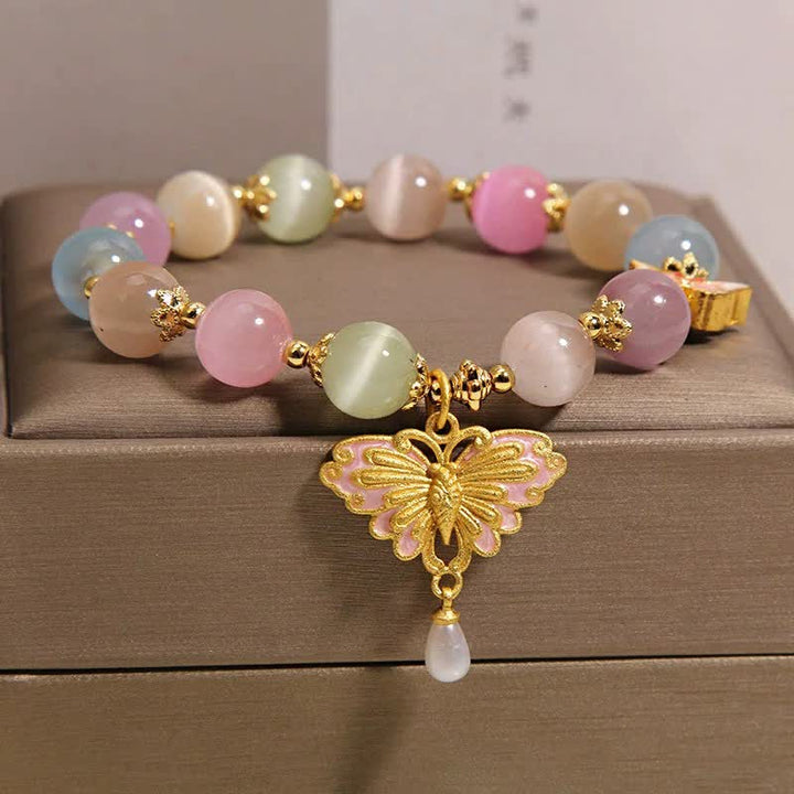Buddha Stones Pulsera multicolor con cuentas de mariposa ojo de gato y amor - image 1