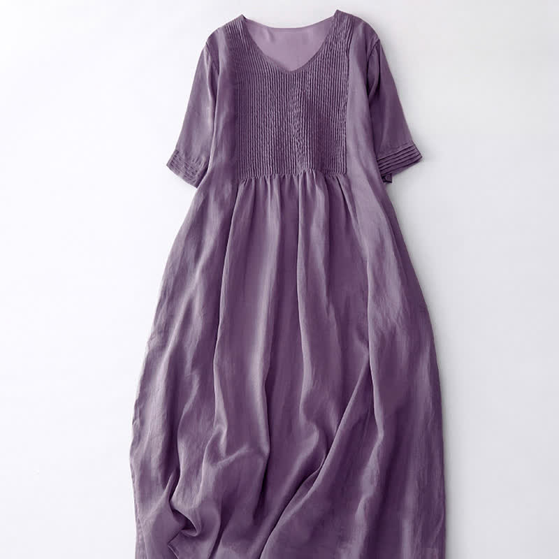 Vestido midi informal de manga corta con cuello en V, pliegues tipo acordeón y bolsillos, con estampado de Buddha Stones. - image 2