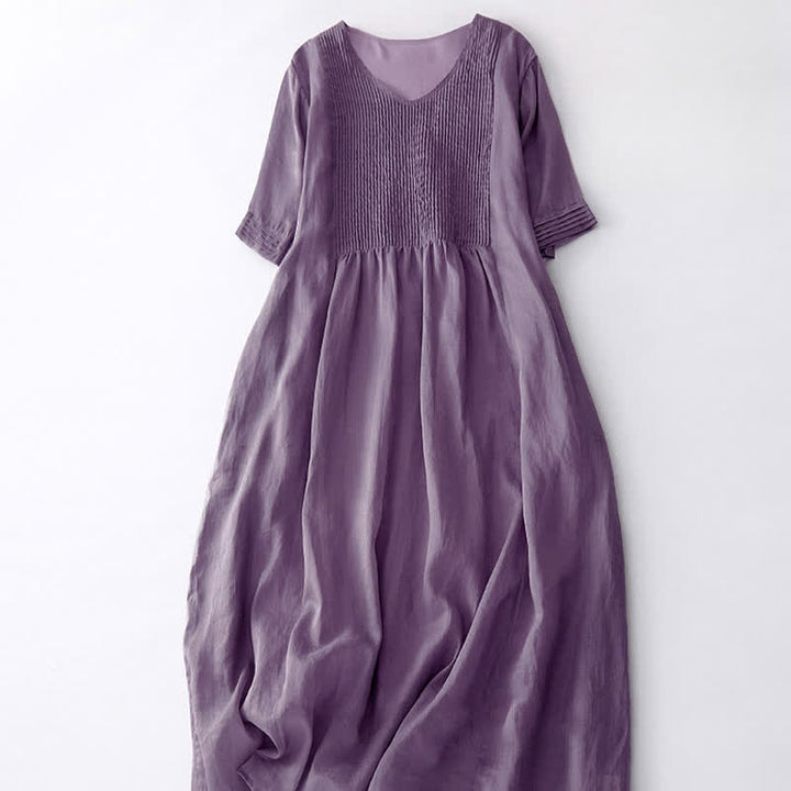 Vestido midi informal de manga corta con cuello en V, pliegues tipo acordeón y bolsillos, con estampado de Buddha Stones. - image 2
