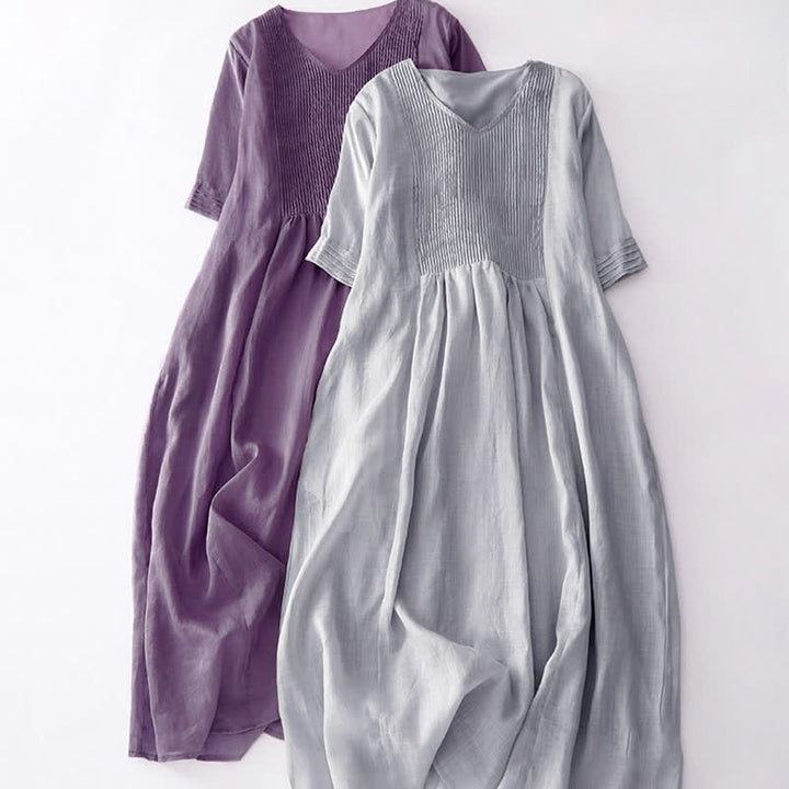 Vestido midi informal de manga corta con cuello en V, pliegues tipo acordeón y bolsillos, con estampado de Buddha Stones. - image 27