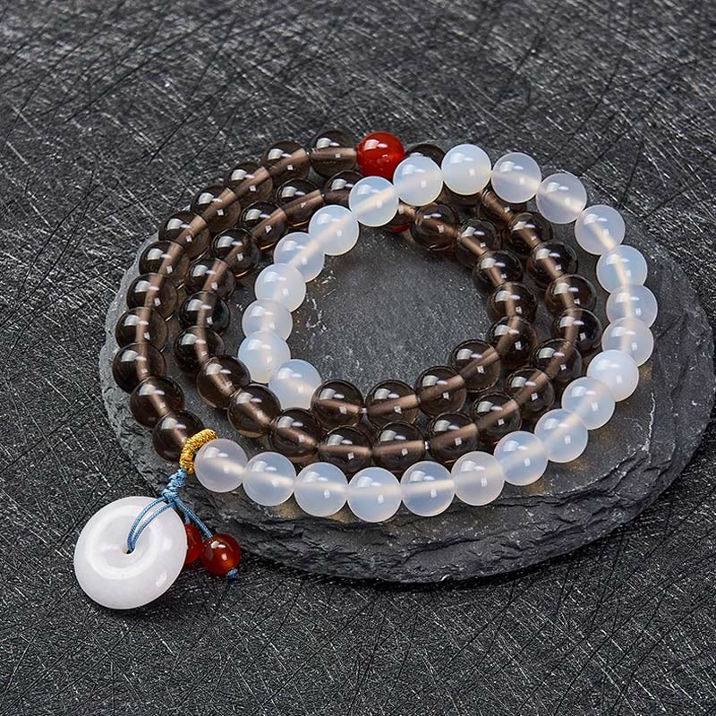 Buddha Stones Pulsera multienrollada con hebilla de paz de obsidiana de hielo y calcedonia blanca, modelo Serenity. - image 1