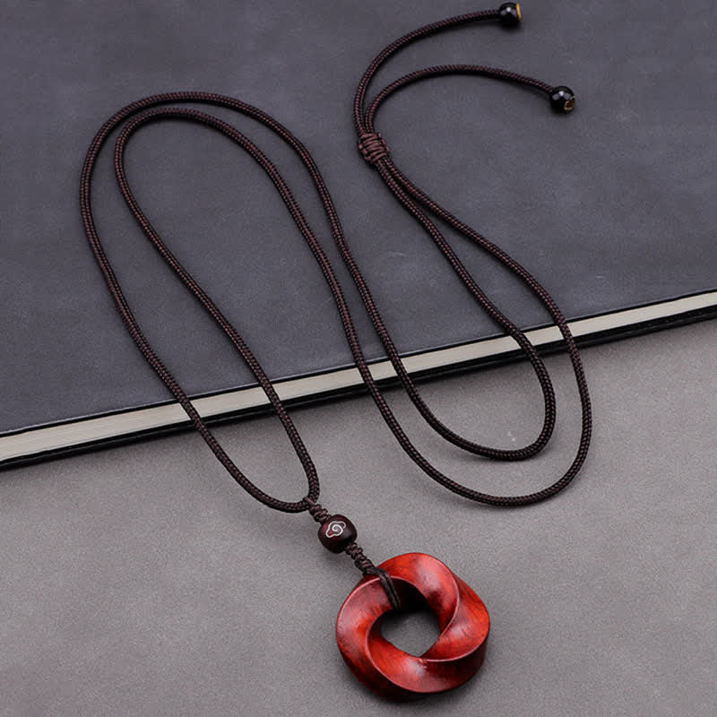Buddha Stones Collar con colgante de cuerda de nudo infinito de sándalo rojo - image 1