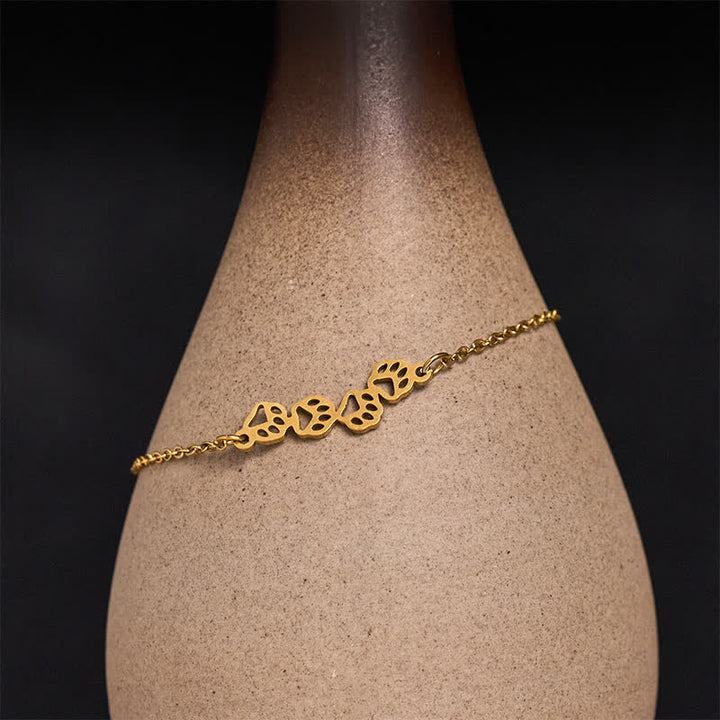 Buddha Stones Pulsera de equilibrio de acero de titanio con cuatro huellas de gato - Golden (circunferencia de la muñeca: 17–22 cm) - image 0