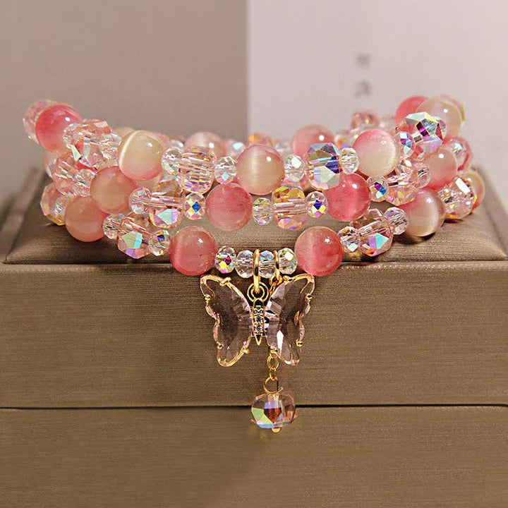 Buddha Stones Pulsera facetada triple con mariposa ojo de gato color melocotón - Mariposa (Transformación ♥ Amor) - image 0