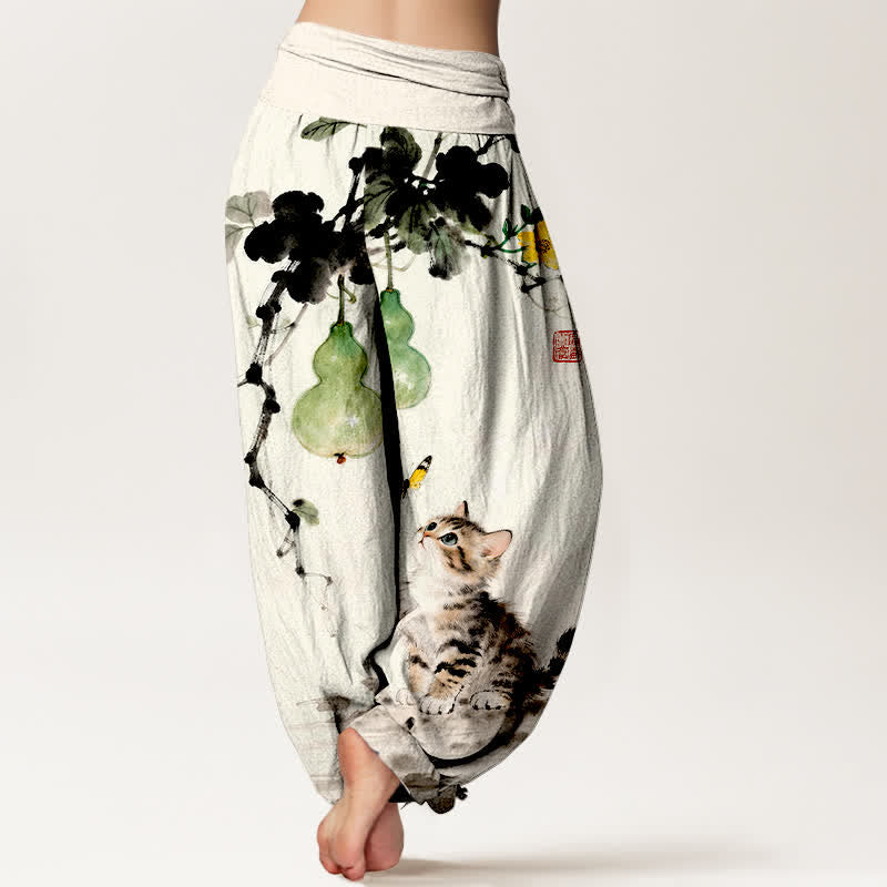 Buddha Stones Pantalones harem de mujer con cintura elástica y estampado de calabaza y gato de Cotton Ink. - image 1